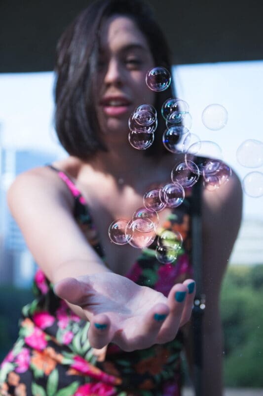 woman holding bubbles